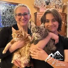 The Miller family with their Maine Coon cats